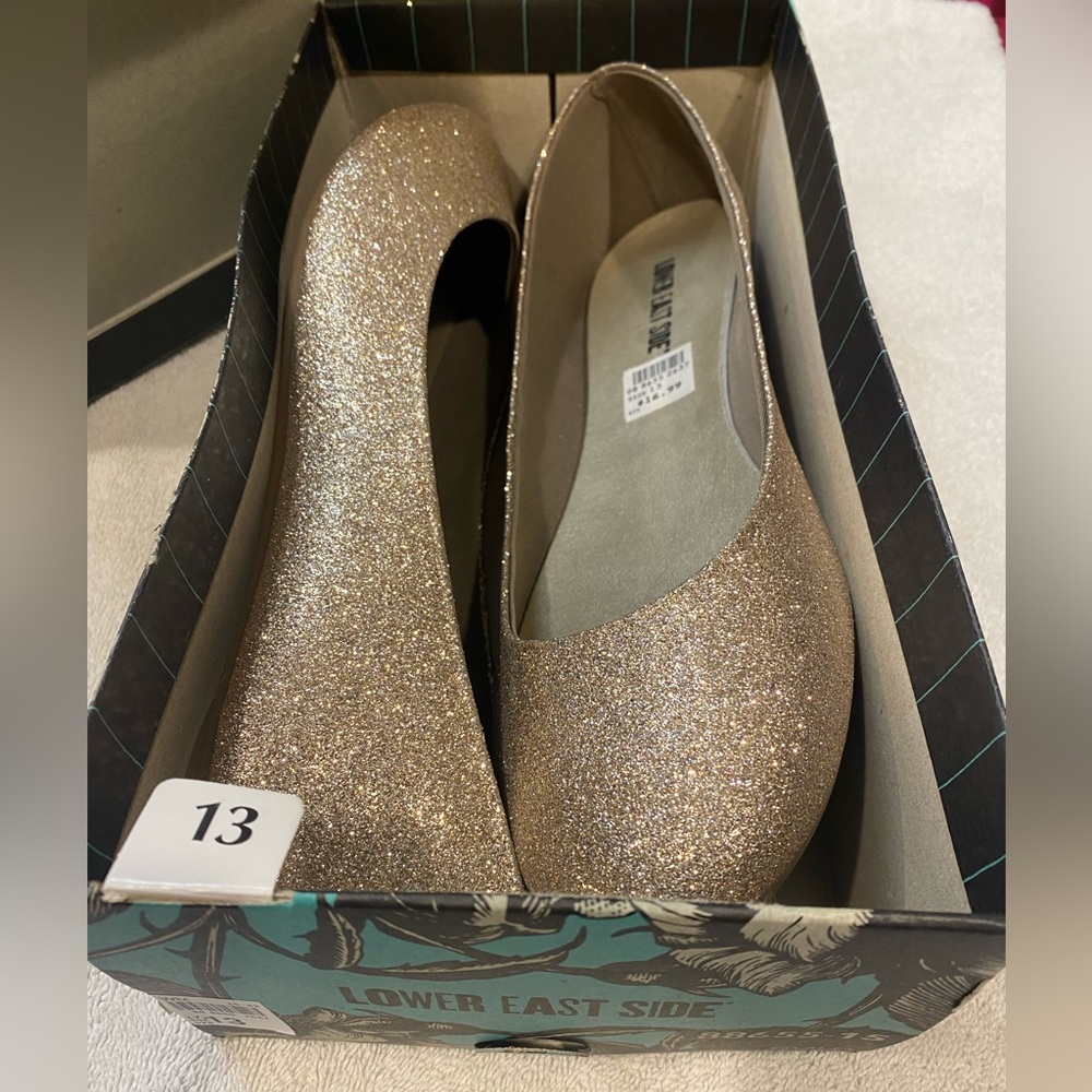 Lower East Side women’s 13 gold glitter ballet flats.